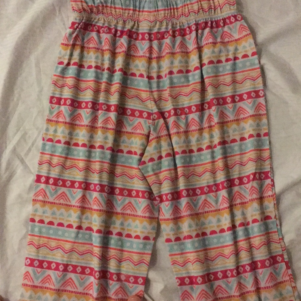 A pair of very well worn pajama pants.